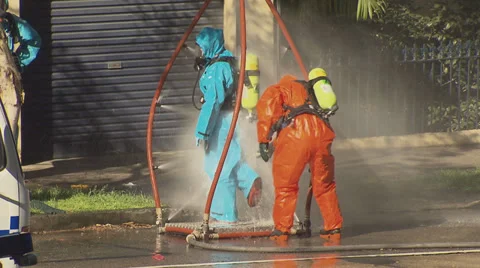 Hazmat suits in use during terrorist incident Stock Footage 30217280