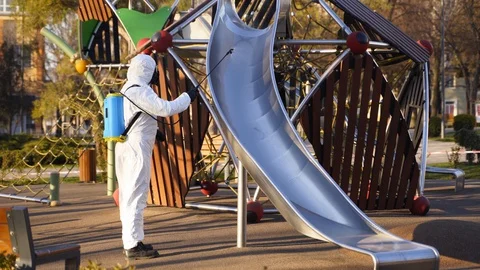 Hazmat team disinfects playground Stock Video Pond5