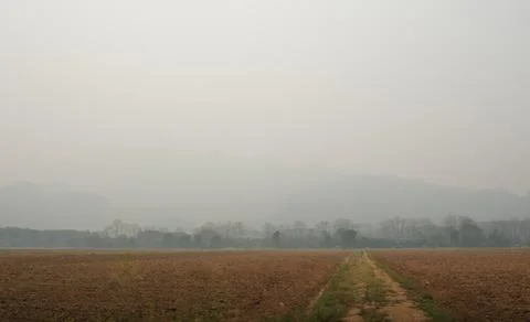Hazy Border Mountain Range Under Smoke Blanket Stock Photos
