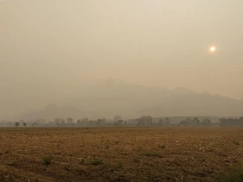Hazy Border Mountain Range Under Smoke Blanket Stock Photos