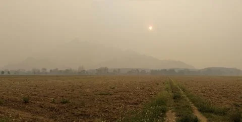 Hazy Border Mountain Range Under Smoke Blanket Stock Photos