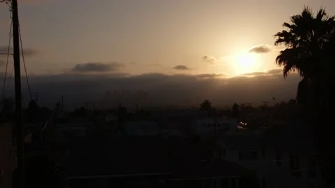 Hazy City with Clouds Passing By and Sunset Stock Footage 154065829