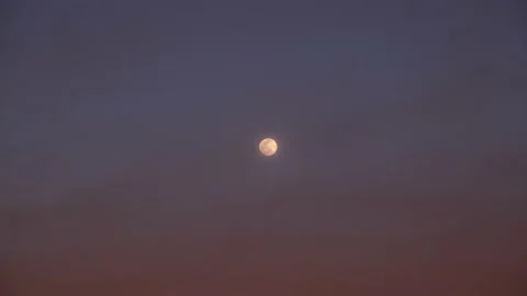 Hazy Moon at Sunset 4k Stock Footage 153004402