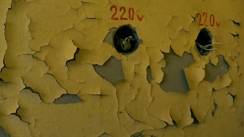 Hazy paint on the wall with two sockets for 220 volts. 2017, Chernobyl, Ukraine Stock Footage 75235425
