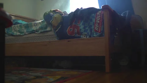 Hazy, shallow depth of field shot of a child's room. Low angle dolly away 스톡 동영상 138787657