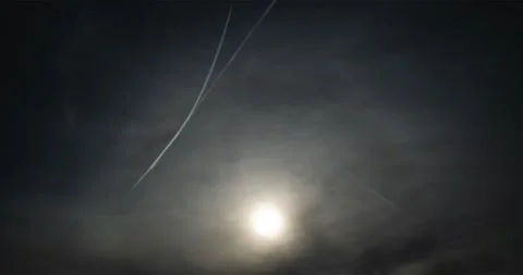 Hazy sky with stacked contrails that rocket off in new direction. Stock Footage 334153722