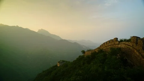 Hazy sunset timelapse on the Great Wall of China and mountains Stock Footage 124997686