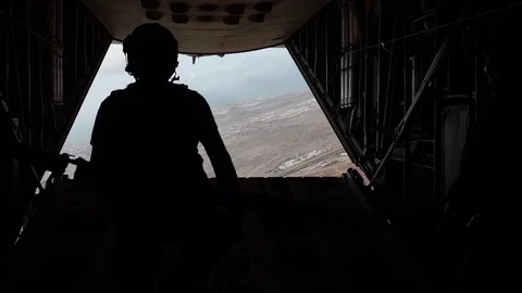 HC-130P King aircrew perform a static line jump Stock Footage 75985674