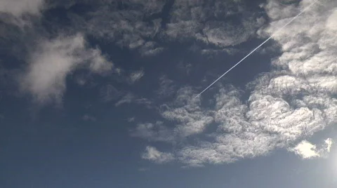 HD 1080 Cloud Timelapse with Jet Con Trail flyby Stock Footage