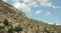 HD 30p Mountain cliff side with clouds passing in time lapse HD Footage