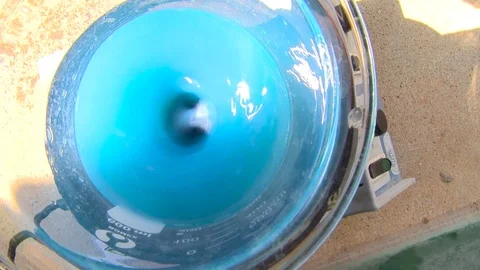 HD Aerial view of a beaker with a blue solution Stock Footage 82618528