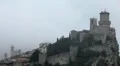 HD Aerial View of San Marino, Guaita Tower, Morning Fog, Castle, Old Town Hall HD Footage