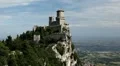 HD Aerial View of San Marino, Guaita Tower, Morning Fog, Castle, Old Town Hall HD Footage