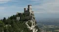 HD Aerial View of San Marino, Guaita Tower, Morning Fog, Castle, Old Town Hall HD Footage