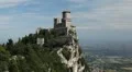 HD Aerial View of San Marino, Guaita Tower, Morning Fog, Castle, Old Town Hall HD Footage