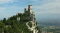 HD Aerial View of San Marino, Guaita Tower, Morning Fog, Castle, Old Town Hall HD Footage