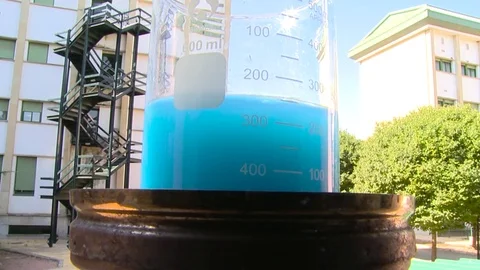 HD Beaker with a blue solution Stock Footage 82618521