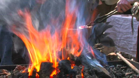 HD Blacksmiths are working in blacksmith show, forge foreground Stock Footage 636880
