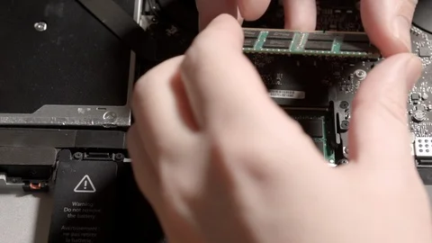 HD A board is installed in the Macbook. Zoom In. Stock-Footage 94450135