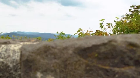 HD Boom up past stone wall and autumn colored hedge to reveal the Vista Video stock 231495929