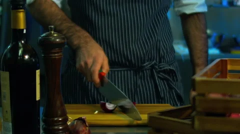 HD cinemagraph. Chef cutting the onion. Motion photo seamless loop Video stock 62755722