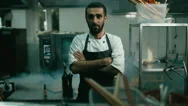 Hd Cinemagraph. Handsome Caucasian Chef Standing In The Restaurant Kitchen Stock Footage