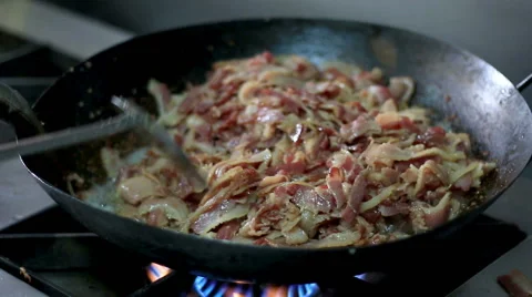 HD close up, Chef Bacon being put into the frying pan Stock Footage 42831770
