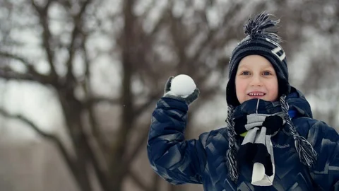 HD Close up shot of a boy throwing out a snowball Video stock 94324884