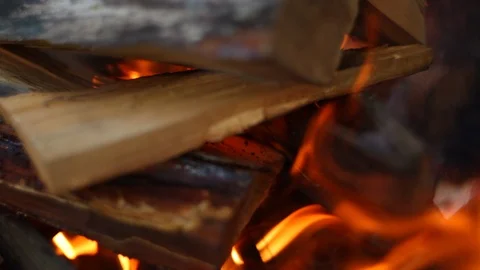 HD Close up shot moving away from a fire with wood burning logs in fire place Stock-Footage 97525532