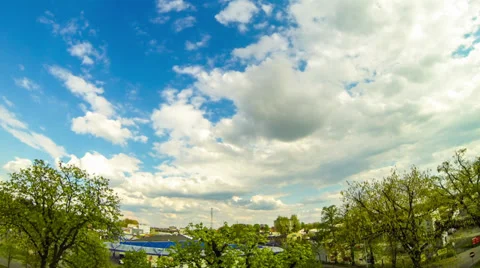 HD clouds passing by over green trees, time lapse, wide angle Stock Footage 37342051