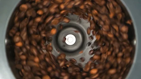 HD - Coffee grinder grinds coffee beans. Slow-mo Stock-Footage 127994267