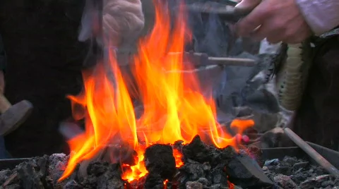 HD Demonstrative work of some blacksmiths with forge foreground Stock-Footage 636890