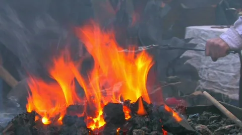 HD Demonstrative work of some blacksmiths with forge foreground Stock Footage 636897