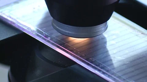 HD Detail of the objective of a microscope Stock Footage 82618432