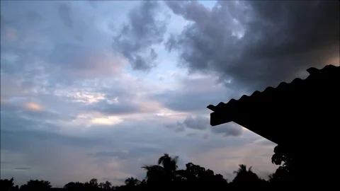 HD Dramatic Dark Clouds Passing Over The Roof Silouette Stock Footage 91249972
