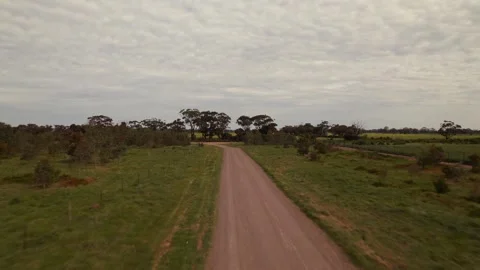 HD Drone shot of flying down a dirt road Stock Footage 163186103