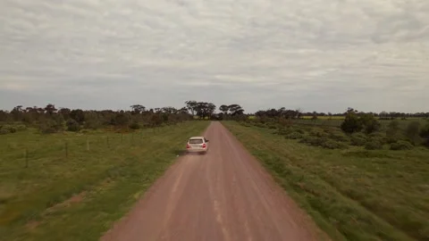 HD Drone shot of tracking a car in a dirt road Stock Footage 163186070