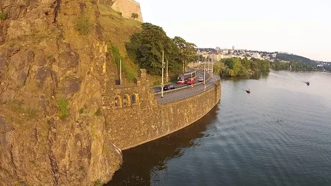 HD EXT DAY aerial going tram through the rocky tunnel along the river Stock Footage 73425219