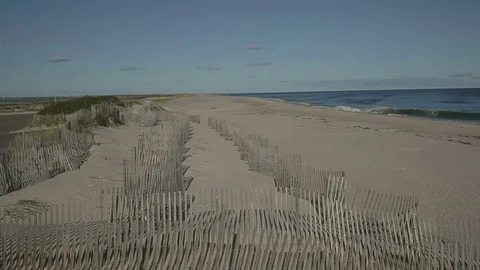 HD EXT DAY pan Long Island beach with view of ocean and blue sky  Stock Footage 73803065