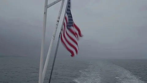 HD EXT DAY pov floating boat on the sea and flying American flag in the wind 動画素材 73802950