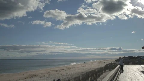 HD EXT DAY static Long Island beach with a view of ocean and couple Stock Footage 73803062
