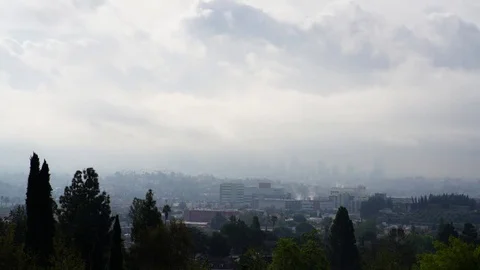HD EXT DAY time-lapse downtown of Los Angeles with a dark cloudy sky Stock Footage 73425455