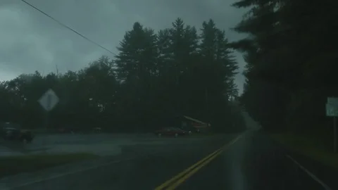HD EXT DUSK pov driving car in the rain through a countryside Stock Footage 73803146