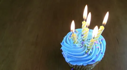 Hd of five birthday candles on a cupcake Stock Footage 11180932