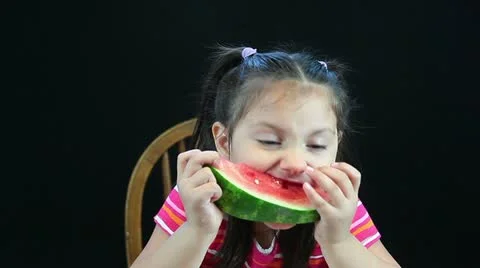 Hd of five year old girl eating watermelon Stock Footage 11037231