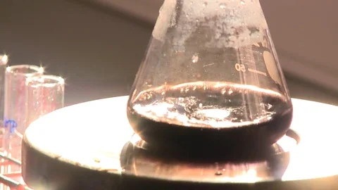HD flask with a boiling black solution Stock Footage 82618419