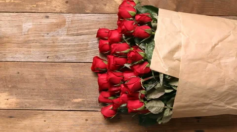 HD footage, Dolly red rose bouquet on old wood background Stock Footage 59556304