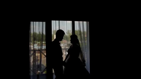 HD Frames From Wedding Day: Bride and Groom at the window of a hotel room in the Stock-Footage 95905683