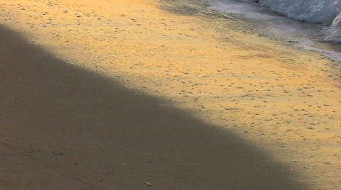 HD Gentle waves on a sandy beach in sunrise, closeup Stock-Footage 597963