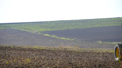 HD The implement of a tractor plowing the land of cultivation Stock Footage 92845417
